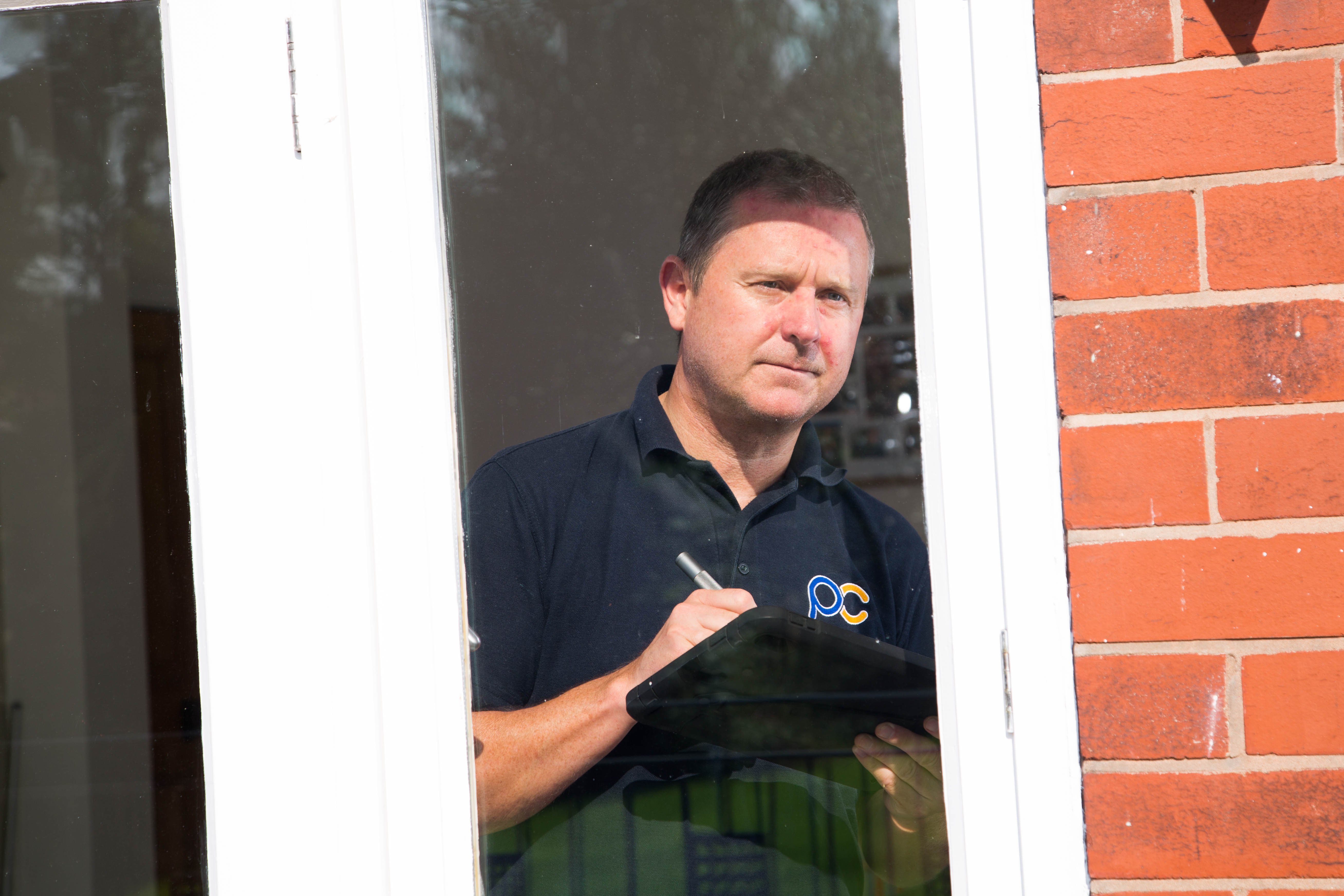 building inspector assessing house interior